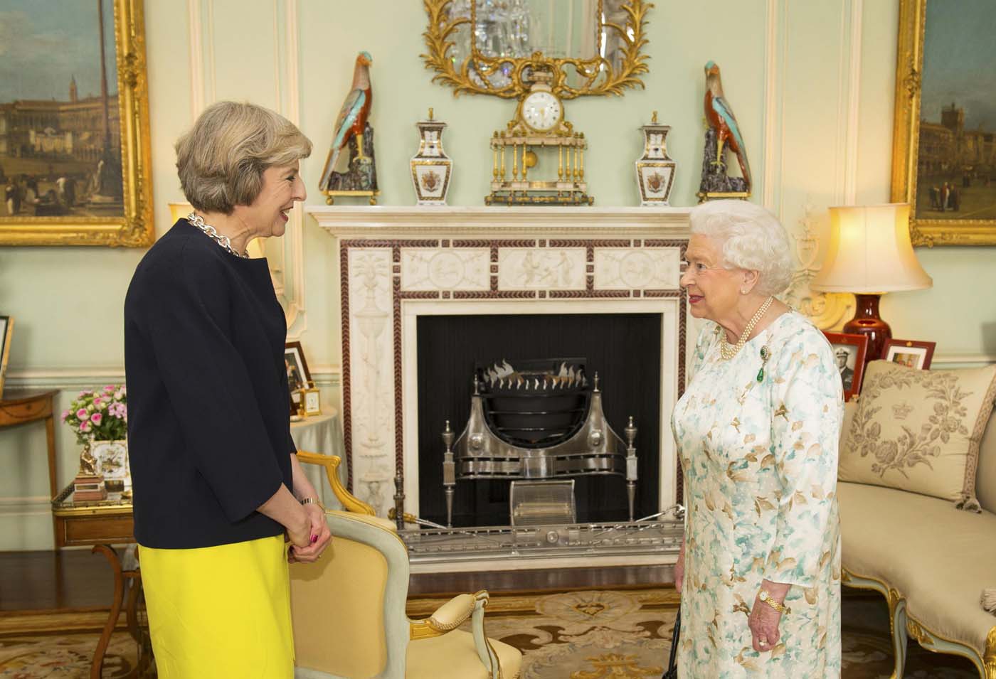 Britain's Queen Elizabeth welcomes Theresa May at the start of an audience in Buckingham Palace, where she invited her to become Prime Minister, in London July 13, 2016. REUTERS/Dominic Lipinski/Pool