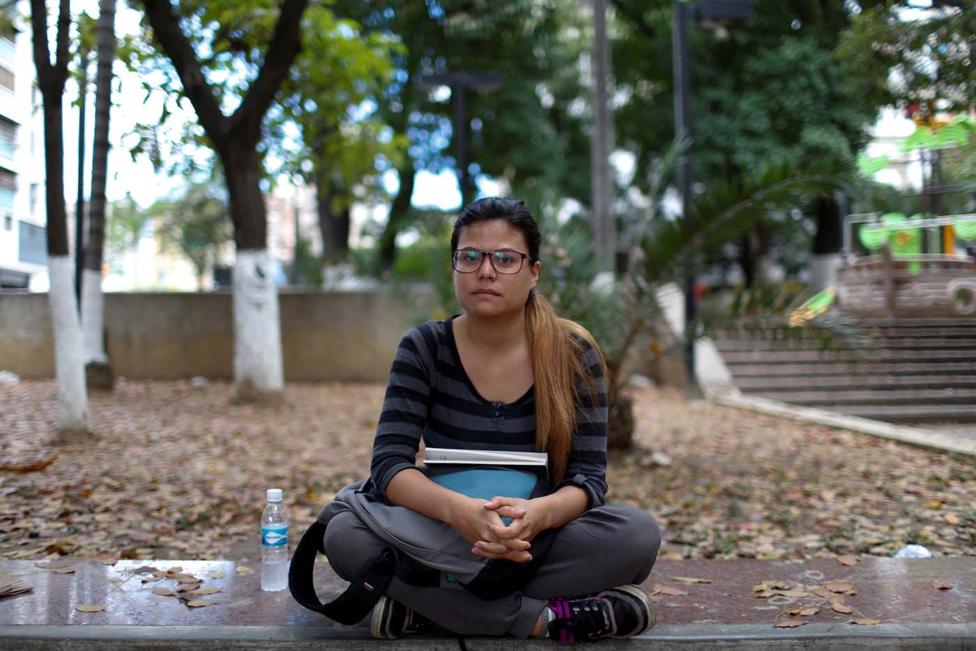 Virginia Diaz (28), journalist, poses for a picture while she waits for legal advice at the Labor Ministry in Caracas, Venezuela March 2, 2017. REUTERS/Carlos Garcia Rawlins