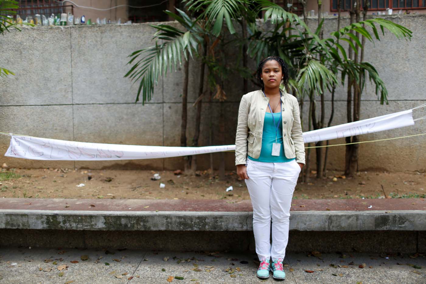  (23) poses for a picture while she waits for legal advice at the Labor Ministry after having been fired from a medical service company, in Caracas, Venezuela March 2, 2017. REUTERS/Carlos Garcia Rawlins