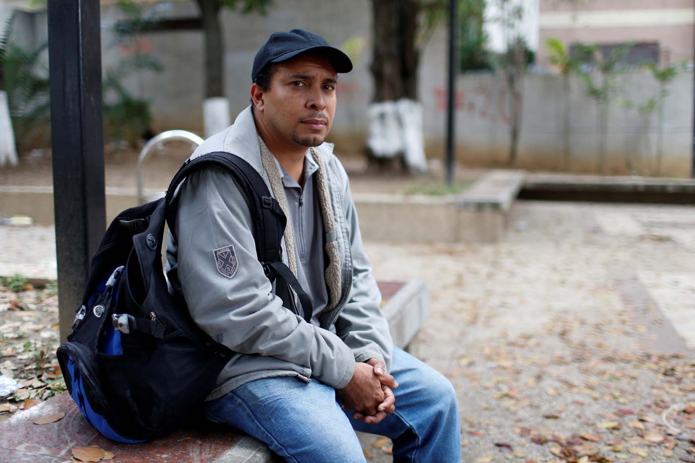 Jose Perez (39), unemployed, poses for a picture while he waits for his wife who is receiving legal advice at the Labor Ministry after having been fired from a state-run supermarket, in Caracas, Venezuela March 2, 2017. REUTERS/Carlos Garcia Rawlins