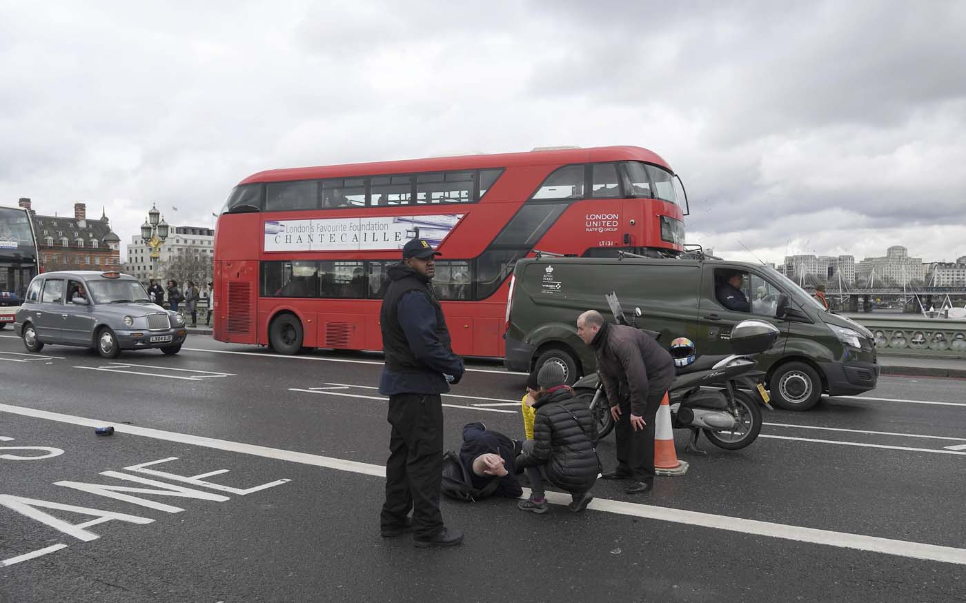 A man lies injured after a shottingt incident on Westminster Bridge in London, March 22, 2017. REUTERS/Toby Melville