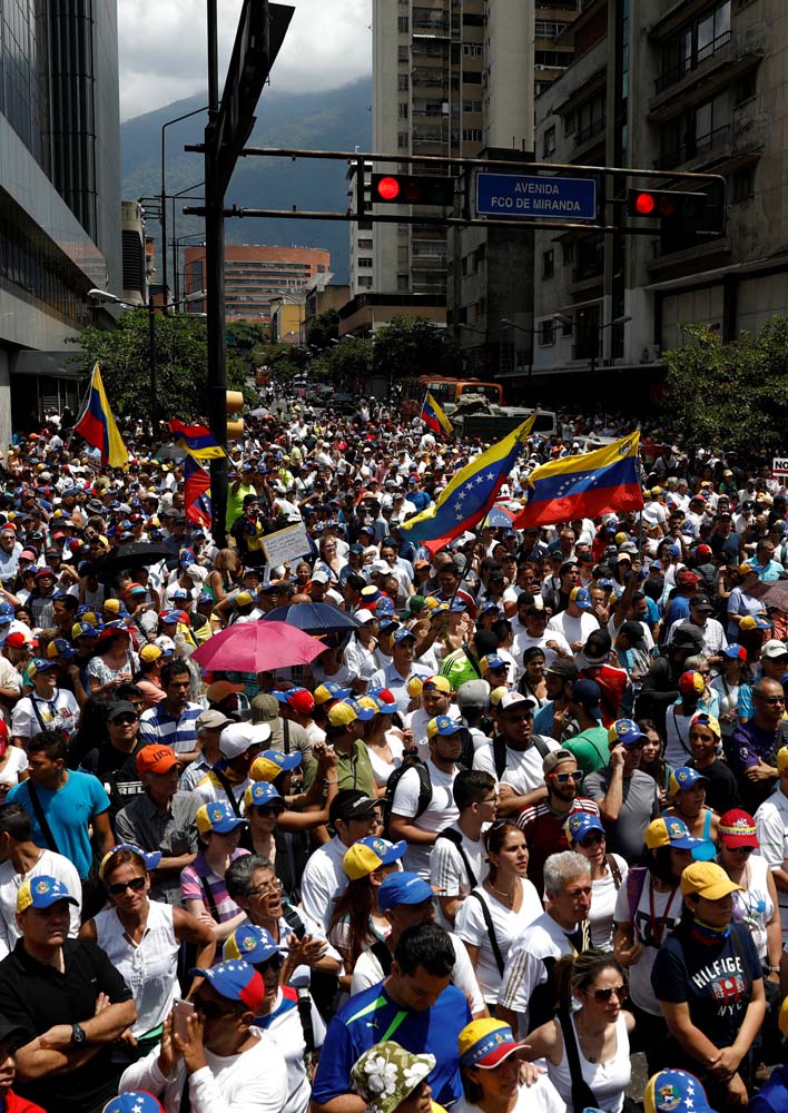 People participate in an opposition rally in Caracas, Venezuela, April 8, 2017. REUTERS/Carlos Garcia Rawlins