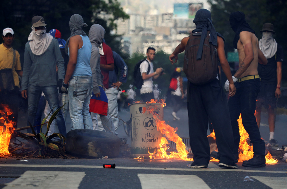 A fire barricade is seen on a street during an opposition rally in Caracas, Venezuela, April 8, 2017. REUTERS/Carlos Garcia Rawlins