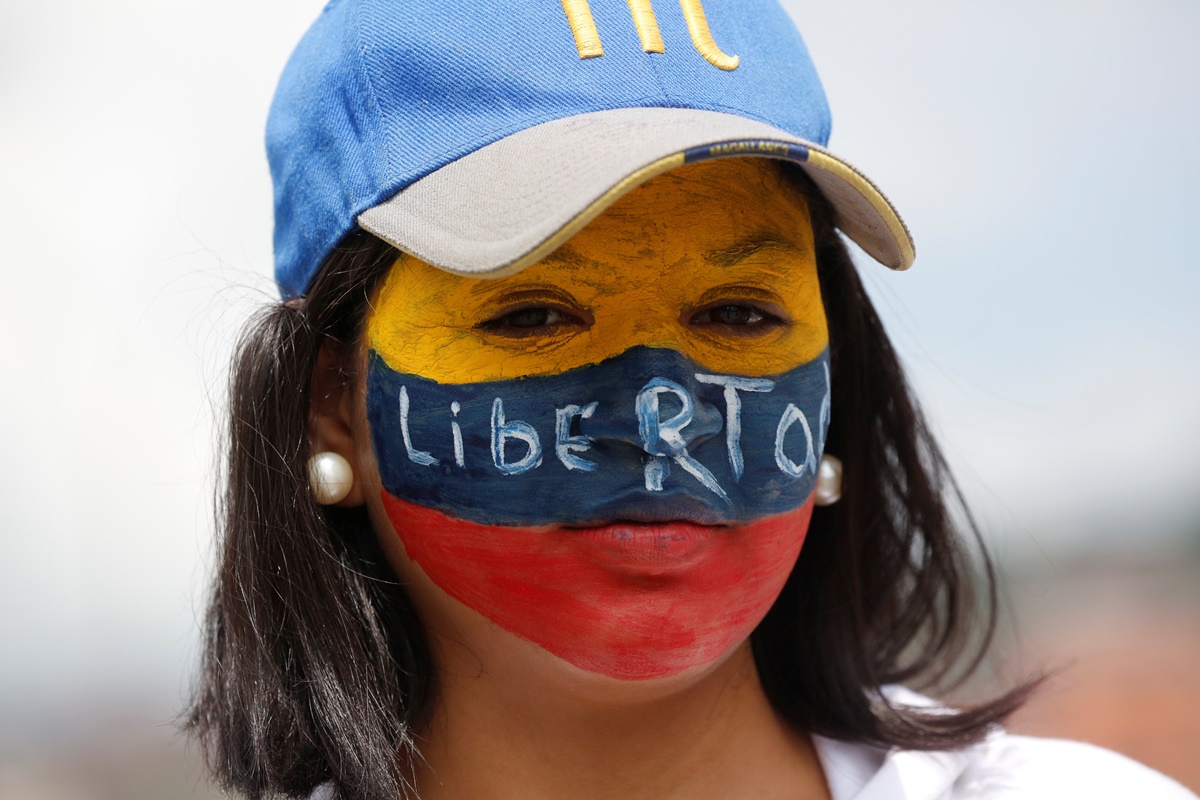 A demonstrator protests against Venezuela's President Nicolas Maduro's government in Caracas, Venezuela, May 13, 2017. REUTERS/Carlos Garcia Rawlins