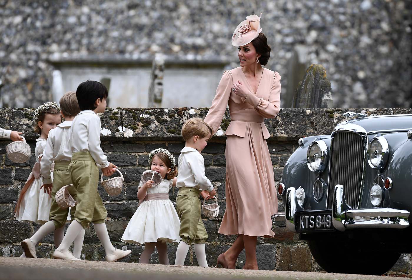 Britain's Catherine, Duchess of Cambridge walks with the flower boys and girls, including Prince George and Princess Charlotte after the wedding of Pippa Middleton and James Matthews at St Mark's Church in Englefield, west of London, on May 20, 2017. REUTERS/Justin Tallis/Pool