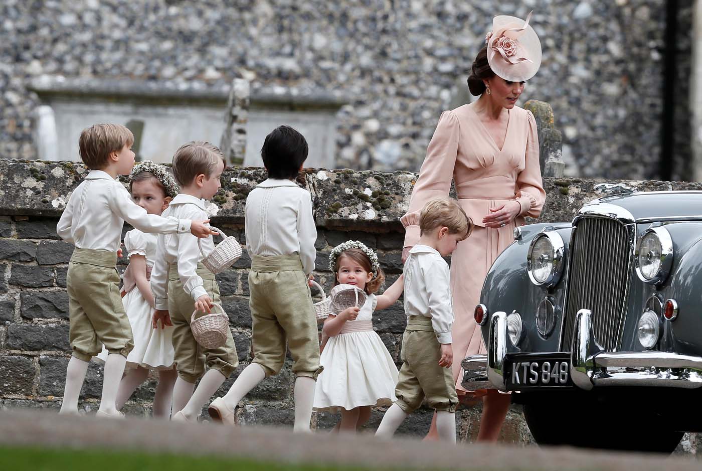 Britain's Catherine, Duchess of Cambridge walks with the flower boys and girls, including Prince George and Princess Charlotte after the wedding of Pippa Middleton and James Matthews at St Mark's Church in Englefield, west of London, on May 20, 2017. REUTERS/Kirsty Wigglesworth/Pool