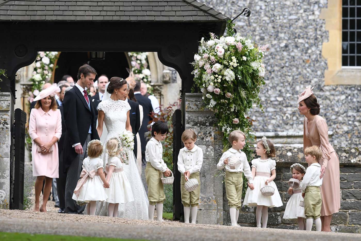 Britain's Catherine, Duchess of Cambridge stands with her children Prince George and Princess Charlotte, following the wedding of her sister Pippa Middleton to James Matthews at St Mark's Church in Englefield, west of London, on May 20, 2017. REUTERS/Justin Tallis/Pool