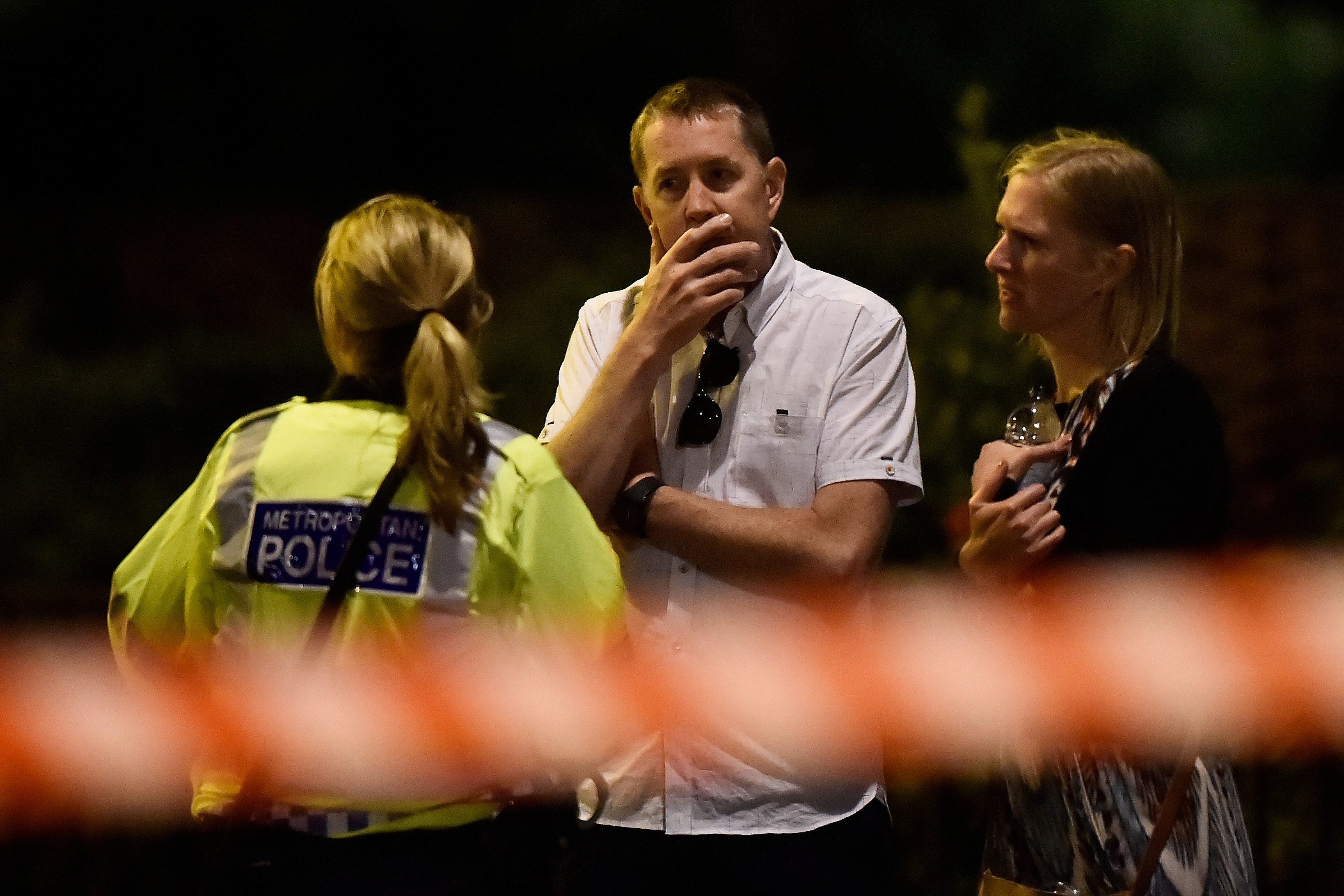 People react as police attend to an incident near London Bridge in London, Britain, June 4, 2017. REUTERS/Hannah McKay