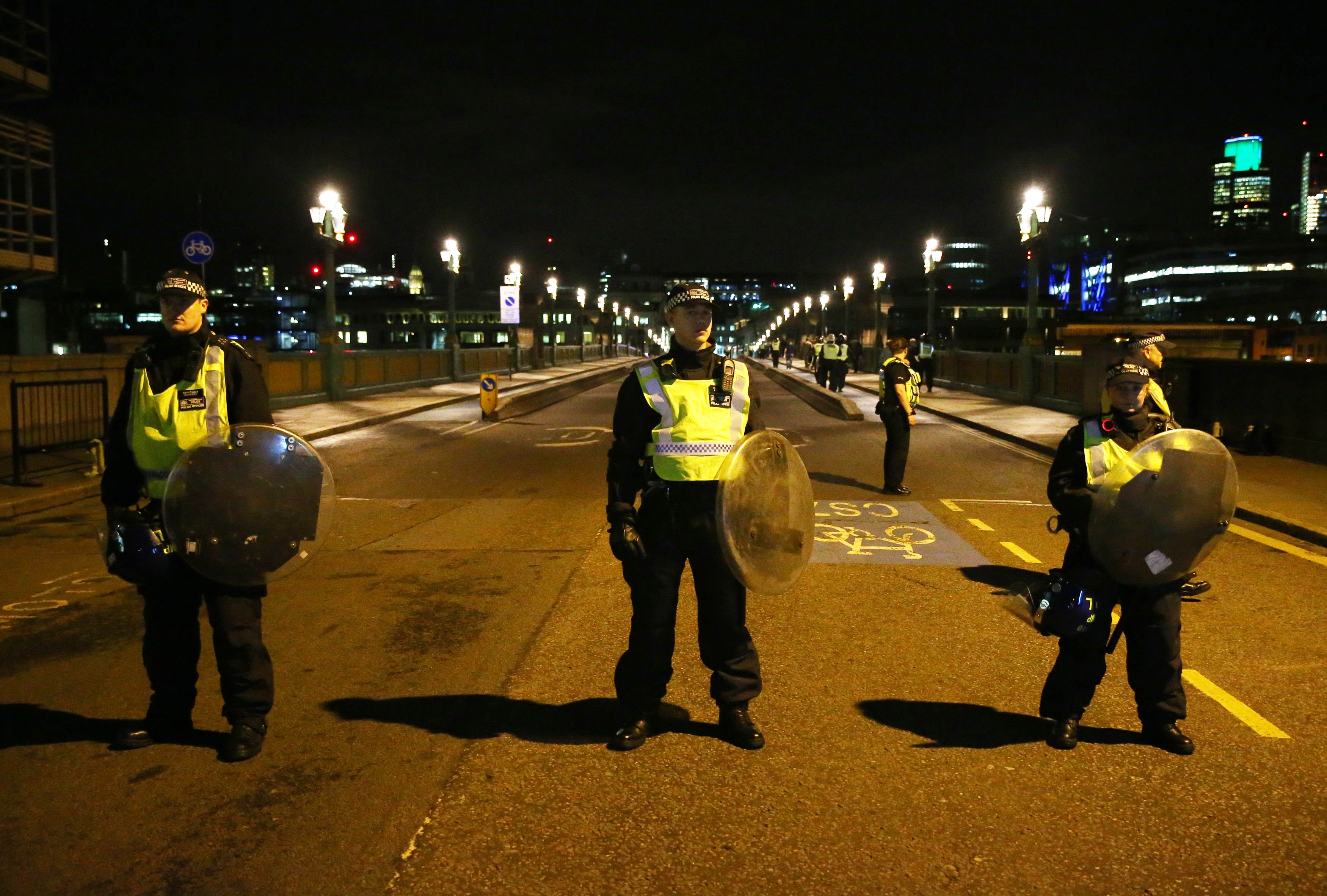 Police officers guard the approach to Southwark Bridge after an incident near London Bridge in London, Britain June 4, 2017. REUTERS/Neil Hall