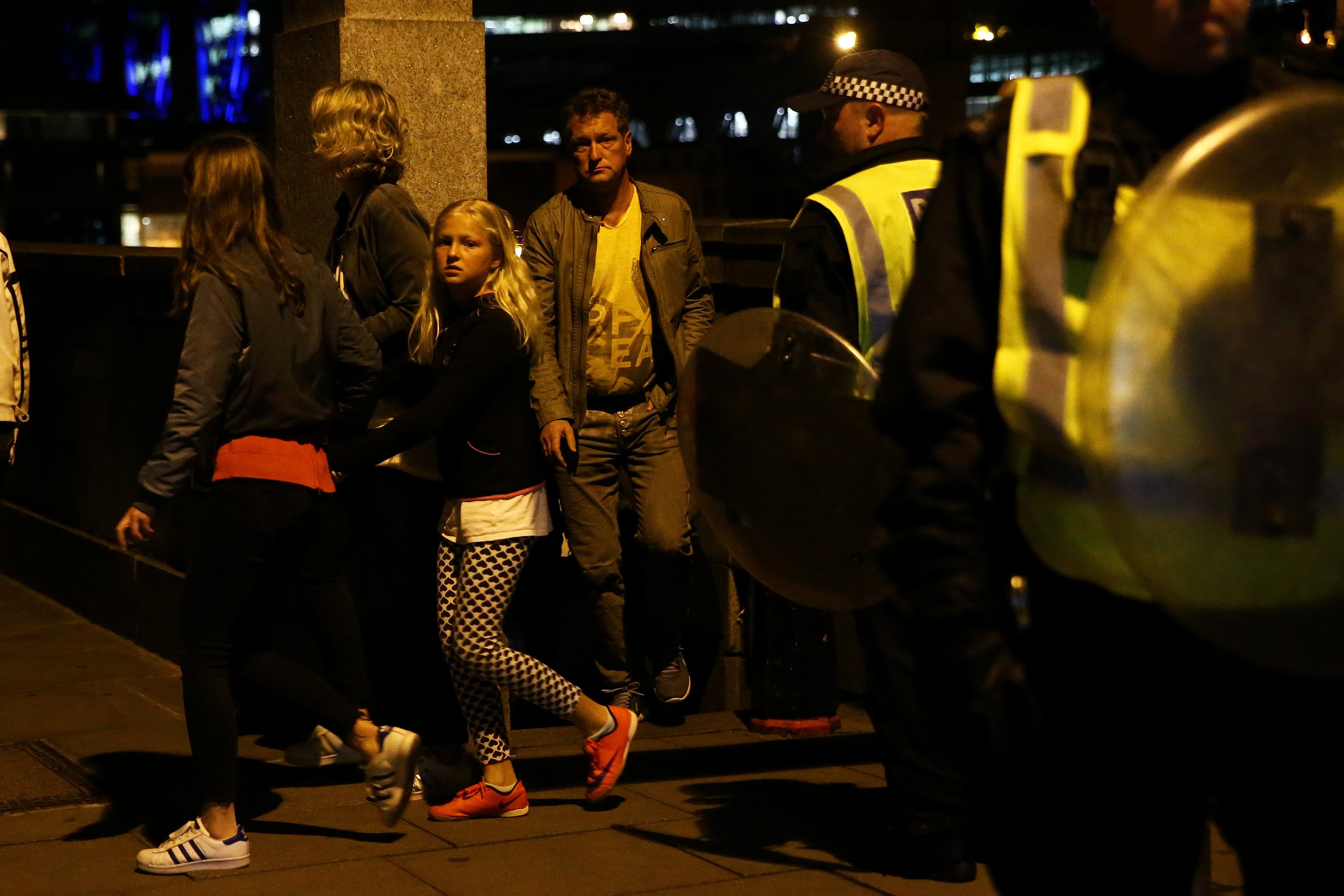 People flee as police attend to an incident near London Bridge in London, Britain, June 4, 2017. REUTERS/Neil Hall