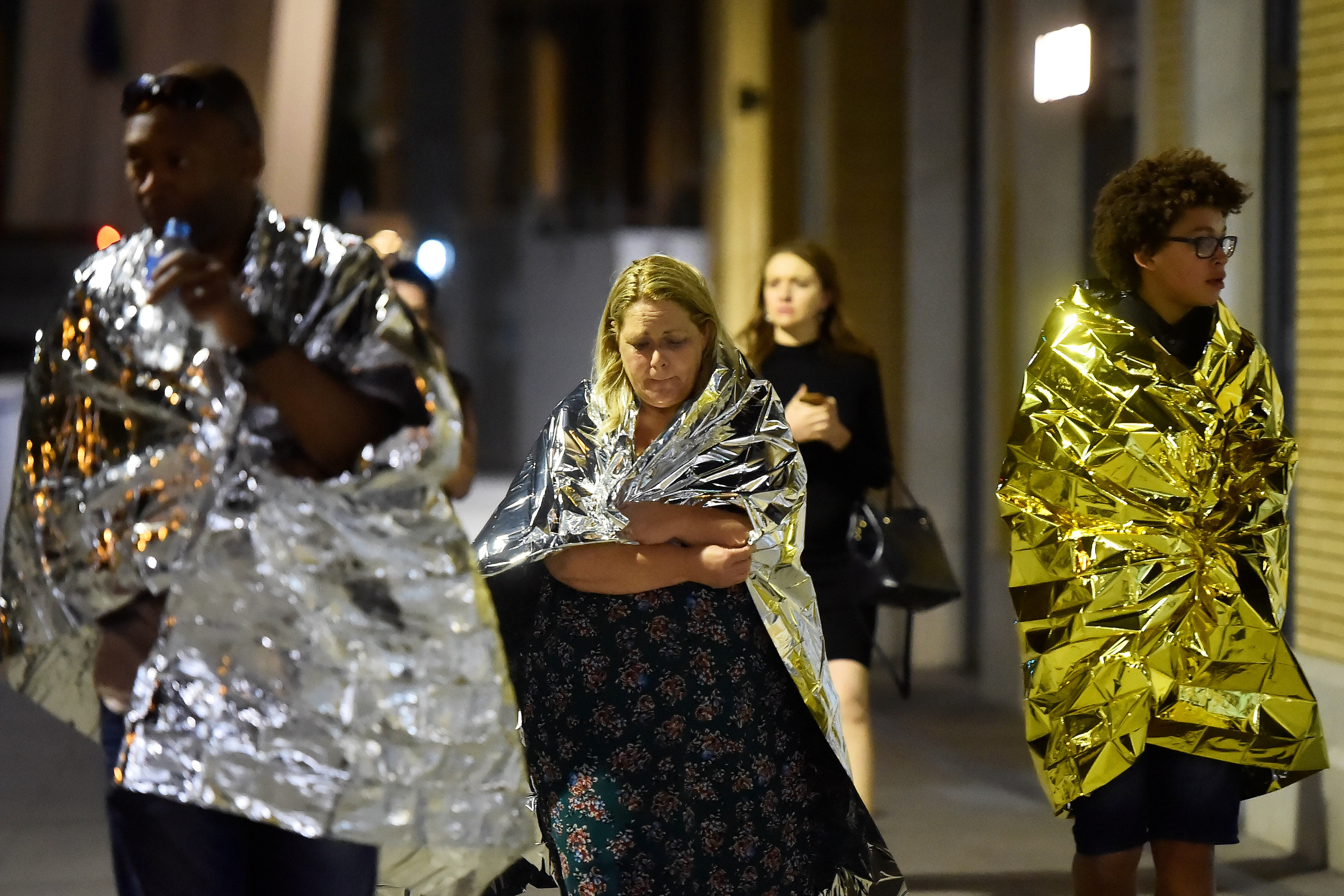 People flee as police attend to an incident near London Bridge in London, Britain, June 4, 2017. REUTERS/Hannah McKay