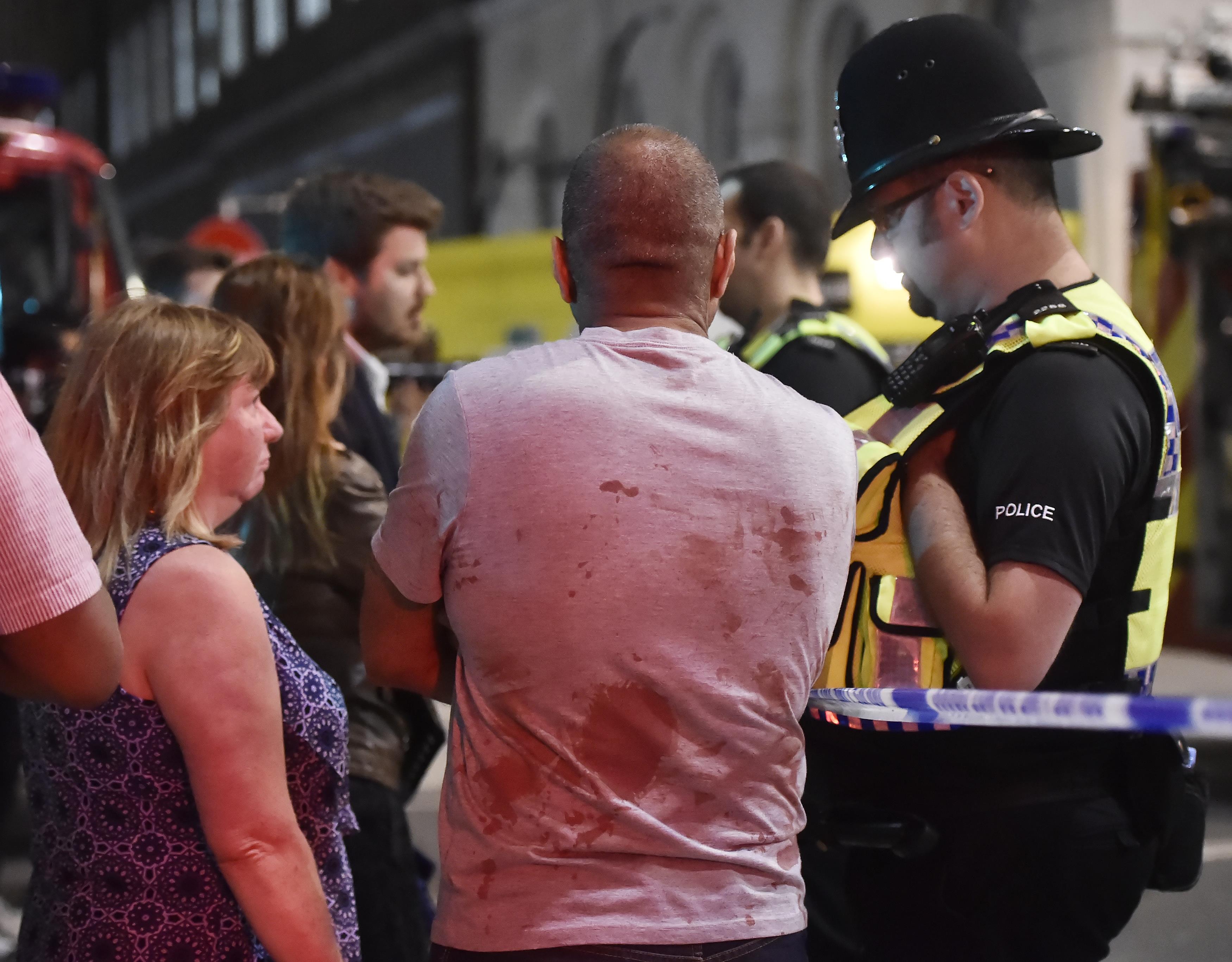 People speak with police officers after an incident near London Bridge in London, Britain June 4, 2017. REUTERS/Hannah Mckay