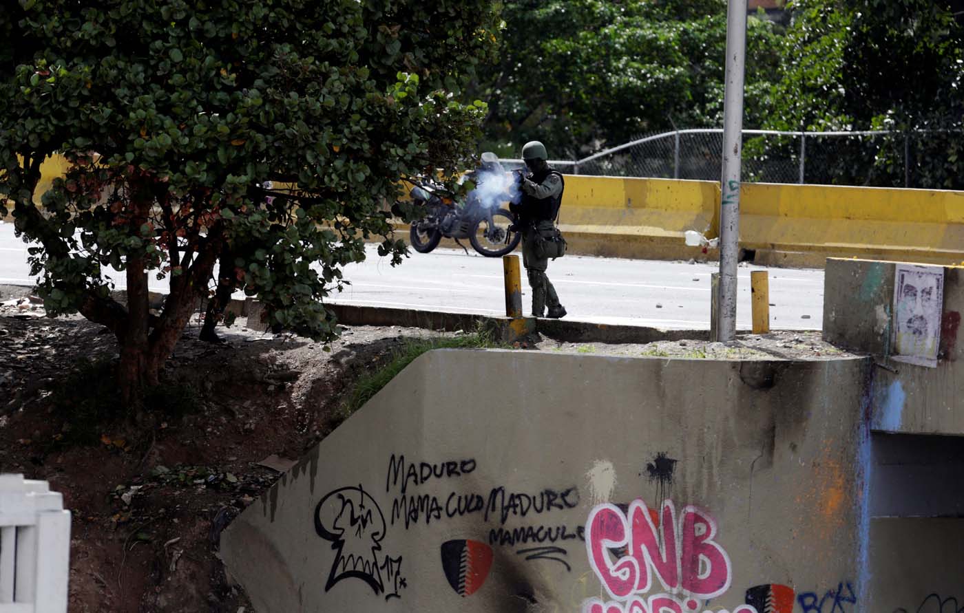 A member of security forces fires tear gas during clashes at a rally against Venezuelan President Nicolas Maduro's government in Caracas, Venezuela, July 6, 2017. REUTERS/Marco Bello