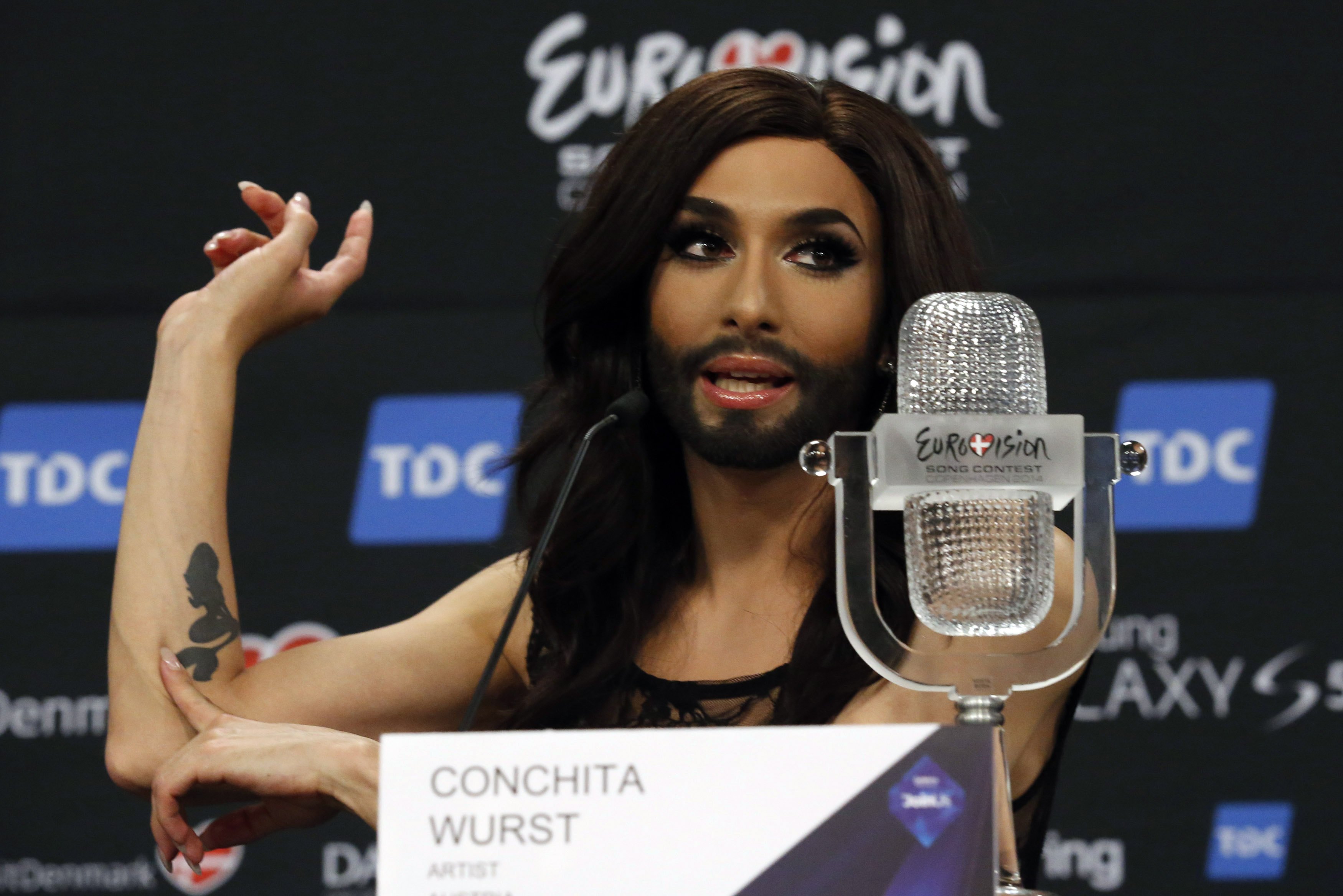 Austrian drag queen Conchita Wurst addresses a news conference after