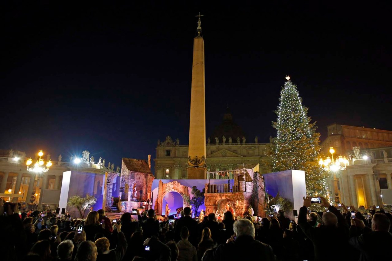 The Vatican Christmas tree and a traditional Crib are lit up after a