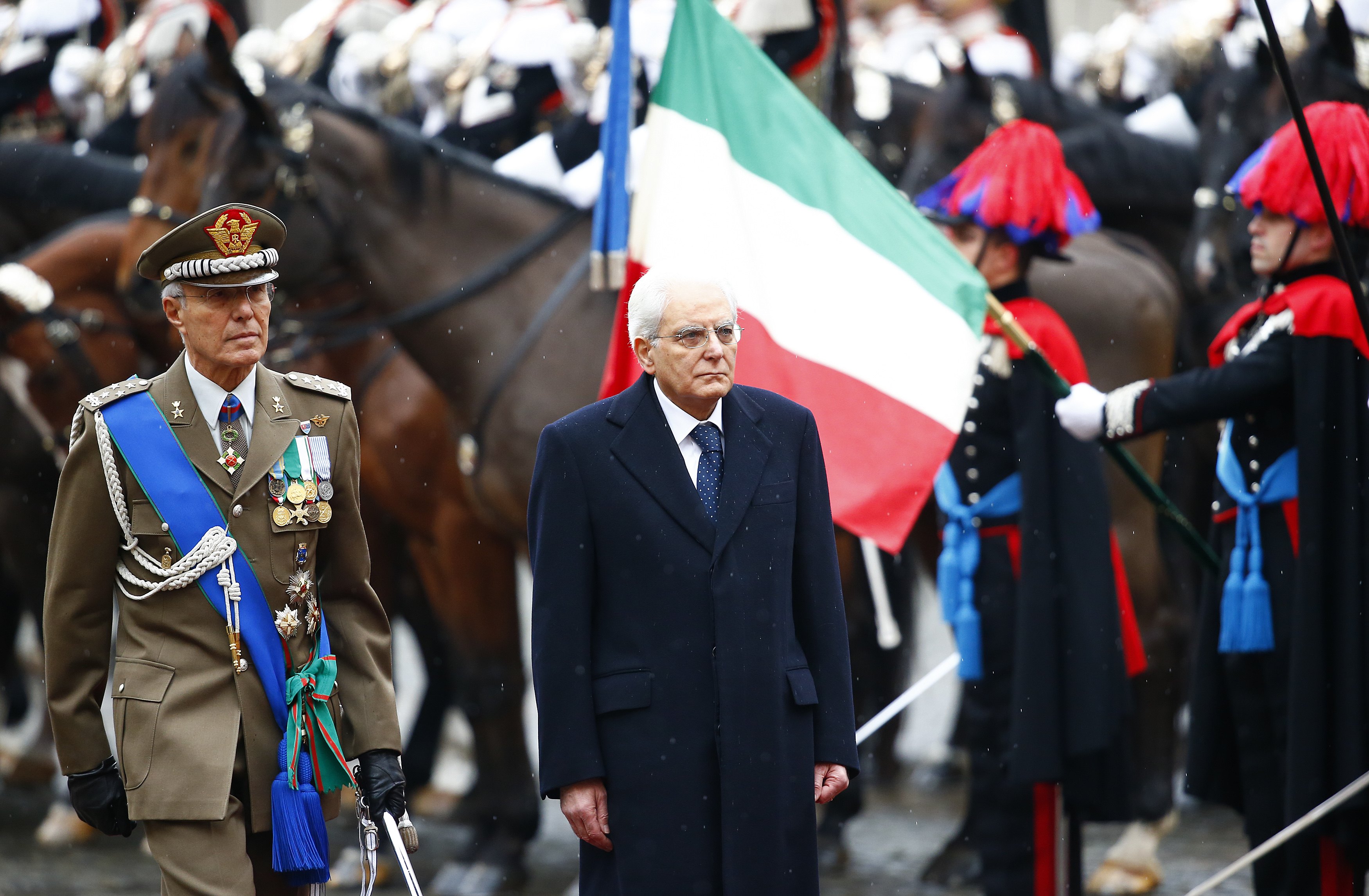 Italy's new President Sergio Mattarella inspects a guard of honour