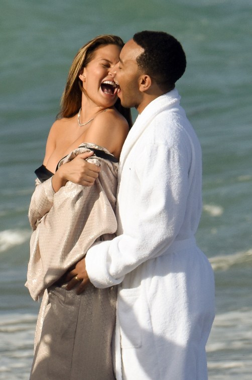 EXCLUSIVE: **PREMIUM RATES APPLY**NO WEB UNTIL 4PM EST MARCH 12 2015** INF - Chrissy Teigen gets naked during a photo shoot with her husband John Legend in Miami Beach.