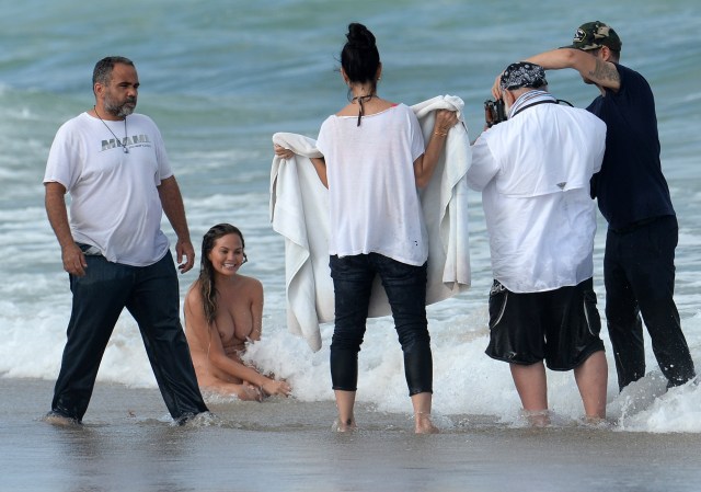 EXCLUSIVE: **PREMIUM RATES APPLY**NO WEB UNTIL 4PM EST MARCH 12 2015** INF - Chrissy Teigen gets naked during a photo shoot with her husband John Legend in Miami Beach.