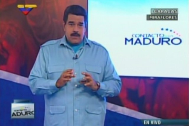 Venezuela's presidential candidate Nicolas Maduro sings during a campaign rally in Caracas