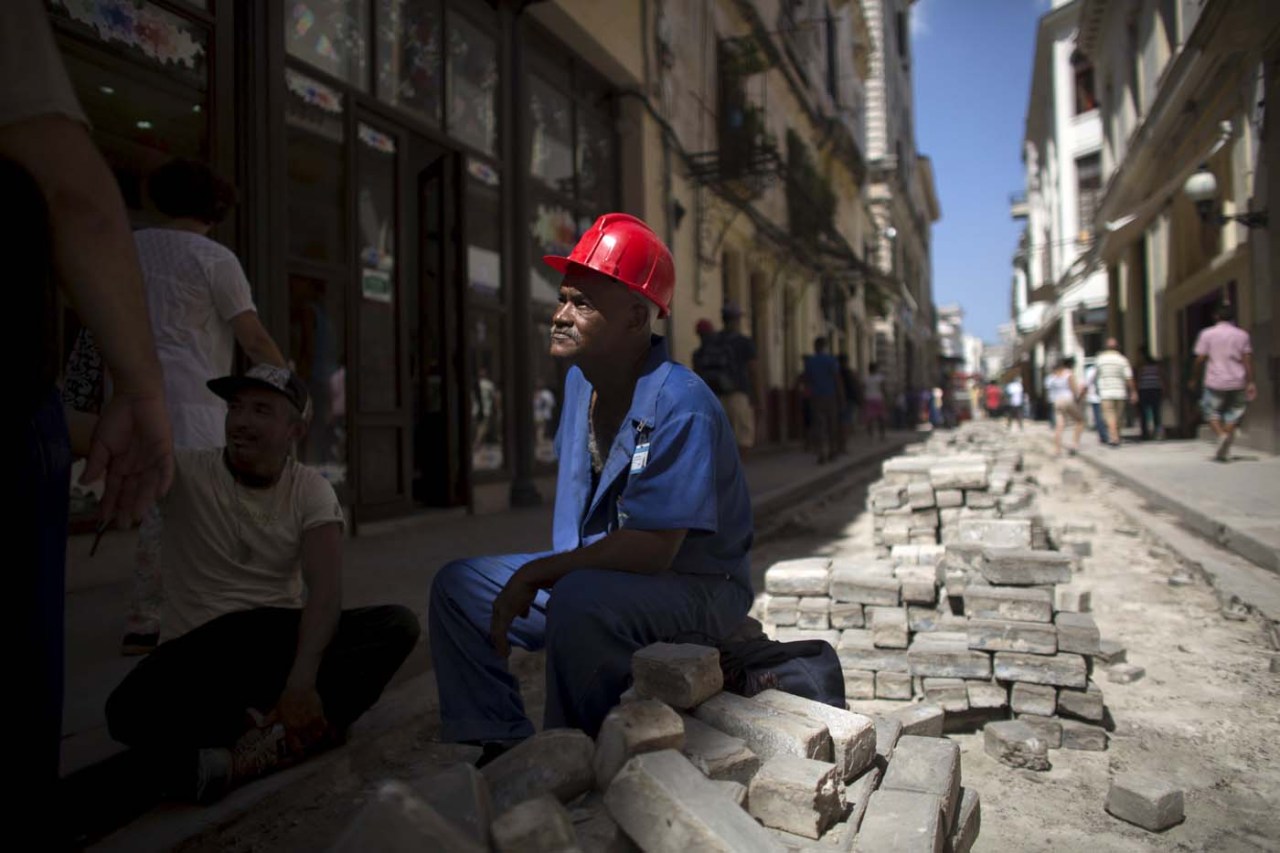 Gilberto Barrera, 49, takes a break during maintenance work at the main