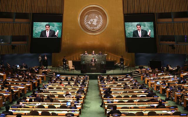 NEW YORK, NY - SEPTEMBER 29: Nicolas Maduro Moros, President of Venezuela, addresses the United Nations General Assembly at UN headquarters on September 29, 2015 in New York City. World leaders gathered for the 70th annual UN General Assembly meeting. Maduro was holding a copy of the historic Jamaica Letter, written by revolutionary leader Simon Bolivar in 1815.   John Moore/Getty Images/AFP