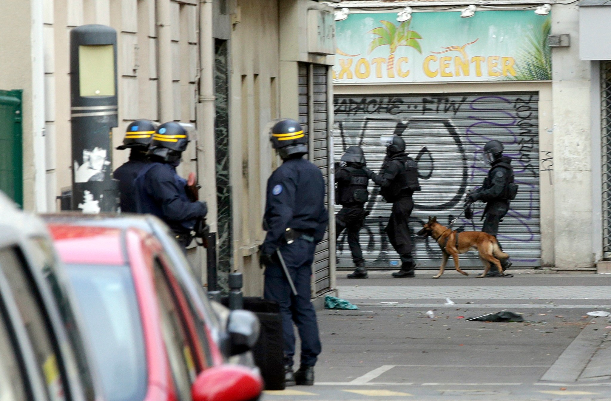 Members of special French RAID forces with a police dog and French riot