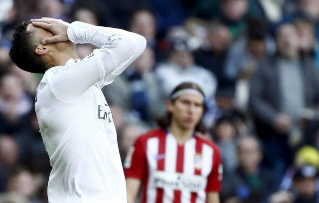 Football Soccer - Real Madrid v  Atletico Madrid - Spanish Liga BBVA - Santiago Bernabeu stadium, Madrid, Spain - 27/02/16 Real Madrid's Cristiano Ronaldo reacts during the match. REUTERS/Juan Medina