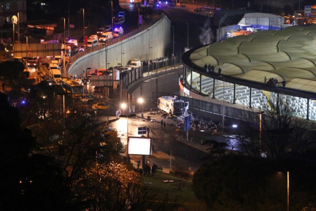 TURKEY OUT This photo obtained from photo agency Depo Photos shows fire fighters and police working at the site of a car bomb explosion outside the stadium of football club Besiktas in central Istanbul on December 10, 2016.   The car bomb exploded in the heart of Istanbul on late December 10, wounding around 20 police officers, Turkey's interior minister said, quoted by the official Anadolu news agency. The bomb, apparently targeting a bus carrying police officers, exploded outside the stadium of Istanbul football club Besiktas following its match against Bursaspor.  / AFP PHOTO / DEPO PHOTOS / Goktay KORALTAN / Turkey OUT