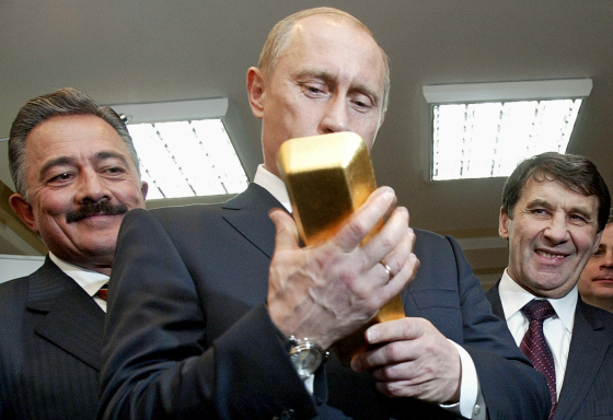 MAGADAN, MAGADAN REGION - JANUARY 16: ARCHIVE PHOTO - Russian President Vladimir Putin examines gold ingots before a meeting with region government on November 22, 2005 in Magadan, Russia.