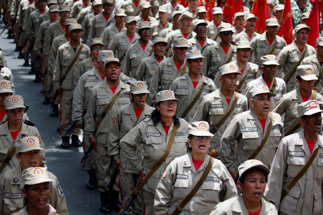 Militia members stand at attention during a ceremony with Venezuela's President Nicolas Maduro at Miraflores Palace in Caracas, Venezuela April 17, 2017. REUTERS/Marco Bello