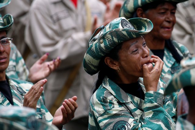 A militia member whistles during a ceremony with Venezuela's President Nicolas Maduro at Miraflores Palace in Caracas, Venezuela April 17, 2017. REUTERS/Marco Bello