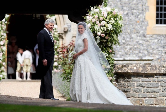 Pippa Middleton, the sister of Britain's Catherine, Duchess of Cambridge, arrives with her father Michael Middleton for her wedding to James Matthews at St Mark's Church in Englefield, west of London, on May 20, 2017. REUTERS/Kirsty Wrigglesworth/Pool