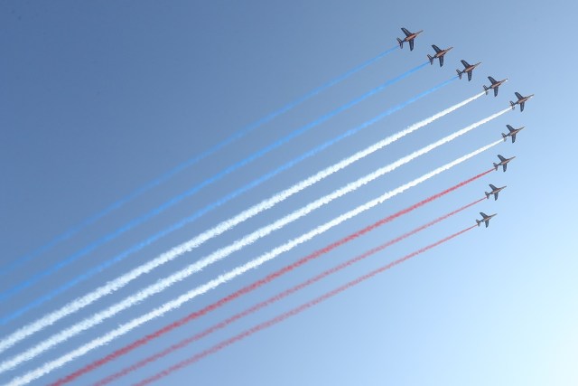 Jets of the Patrouille Acrobatique de France perform during a commemorative ceremony marking the first anniversary of a jihadist truck attack which killed 86 people in Nice, southern France, on Bastille Day, July 14, 2017. Bastille Day celebrations were tinged with mourning, as the Mediterranean city of Nice payed tribute to the victims of an attack claimed by the Islamic State group one year ago, where a man drove a truck into a crowd, killing 86 people.   / AFP PHOTO / Valery HACHE