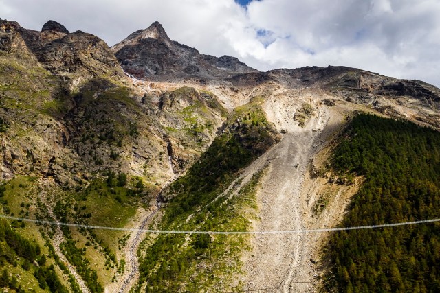 The "Europabruecke" bridge, supposed to be the world's longest pedestrian suspension bridge with a length of 494m, is pictured one day prior to the official inauguration of the construction, in Randa, Switzerland, on Friday, July 28, 2017. The bridge is situated on the Europaweg, that connects the villages of Zermatt and Graechen. (Valentin Flauraud/Keystone via AP)