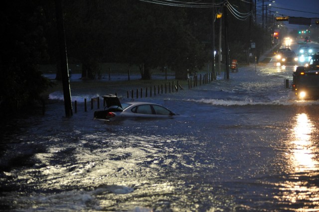 An abandoned vehicle is covered by floodwater after Hurricane Harvey inundated the Texas Gulf coast with rain causing widespread flooding, in Houston, Texas, U.S. August 28, 2017. Picture taken August 28, 2017. REUTERS/Nick Oxford