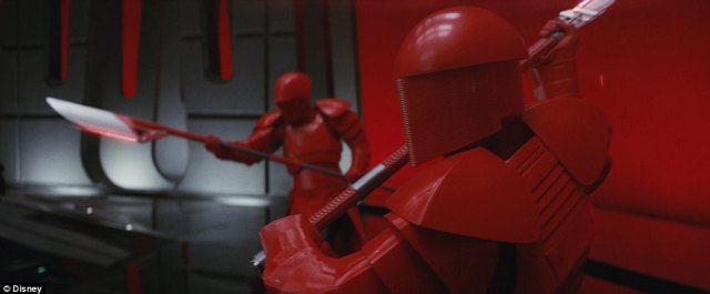 Red menace_ Soldiers in full red uniforms with helmets and masks are seen