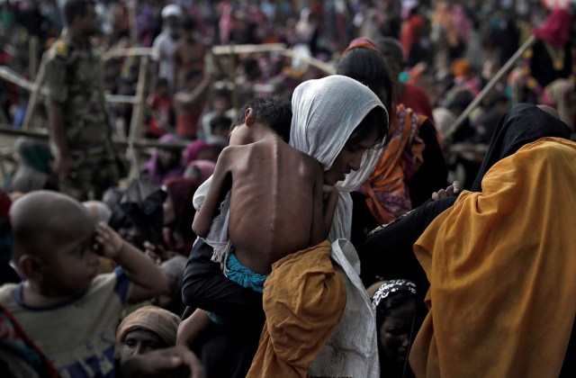 A woman carries her ill child in a refugee camp at Cox's Bazar, Bangladesh, September 26, 2017. REUTERS/Cathal McNaughton/File Photo      SEARCH "POY GLOBAL" FOR THIS STORY. SEARCH "REUTERS POY" FOR ALL BEST OF 2017 PACKAGES.    TPX IMAGES OF THE DAY