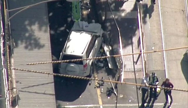 Police and emergency services attend to the scene of an incident involving a vehicle on Flinders Street, as seen from Swanson Street, in Melbourne, Australia December 21, 2017. NINE NETWORK/Reuters TV via REUTERS ATTENTION EDITORS - THIS IMAGE WAS PROVIDED BY A THIRD PARTY. NO RESALES. NO ARCHIVE. AUSTRALIA OUT. NEW ZEALAND OUT. PAPUA NEW GUINEA OUT.