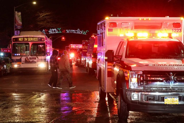 Fire Department of New York (FDNY) personnel work on the scene of an apartment fire in Bronx, New York, U.S. December 28, 2017. REUTERS/Amr Alfiky