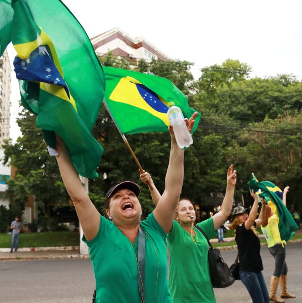 Women wave Brazilian national flags as they celebrate after a Brazilian appeals court upheld the corruption conviction of former President Luiz Inacio Lula da Silva, in Porto Alegre, Brazil January 24, 2018. REUTERS/Diego Vara