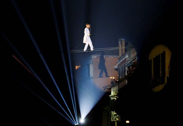 A tightrope walker performs during the opening ceremony of the Carnival in Venice, Italy January 27, 2018. REUTERS/Manuel Silvestri