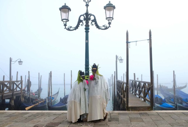 Masked revellers pose during the Carnival in Venice, Italy January 28, 2018. REUTERS/Manuel Silvestri