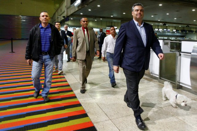Spanish ambassador to Venezuela Jesus Silva (R) walks to the departure area at the Maiquetia international airport in Caracas, Venezuela January 29, 2018. REUTERS/Christian Veron