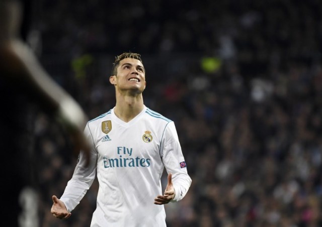 Real Madrid's Portuguese forward Cristiano Ronaldo looks upwards during the UEFA Champions League round of sixteen first leg football match Real Madrid CF against Paris Saint-Germain (PSG) at the Santiago Bernabeu stadium in Madrid on February 14, 2018.   / AFP PHOTO / CHRISTOPHE SIMON