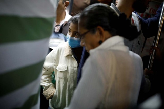 Yasmira Castano, 40, who lost her transplanted kidney, rides the metro after she received a dialysis session at a state hospital in Caracas, Venezuela February 14, 2018. Castano was unable to find the drugs needed to keep her body from rejecting the organ. On Christmas Eve 2017, she was rushed to a state hospital. Her immune system had attacked the foreign organ and she lost her kidney shortly afterwards. Picture taken February 14, 2018. REUTERS/Carlos Garcia Rawlins