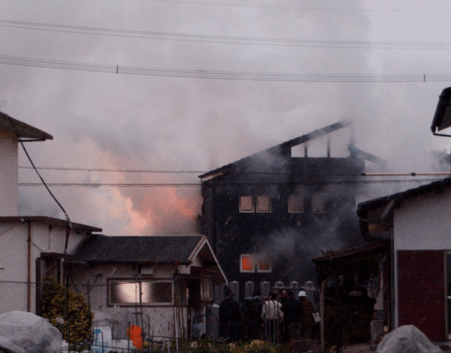 Smoke billows from a house after a Japan's Ground Self-Defense Force's Apache attack helicopter crashed in Kanzaki, Saga prefecture, Japan, in this photo taken by Kyodo February 5, 2018. Mandatory credit Kyodo/via REUTERS 