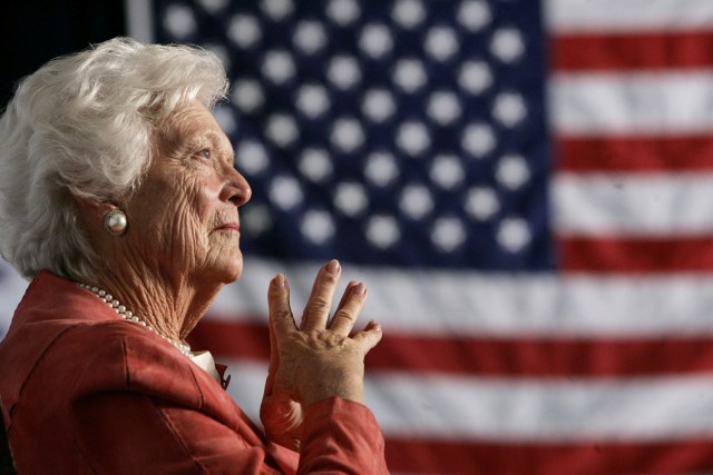 FILE PHOTO: Former U.S. first lady Barbara Bush listens to her son, President George W. Bush, as he speaks at an event on social security reform in Orlando, Florida March 18, 2005. REUTERS/Jason Reed/File Photo