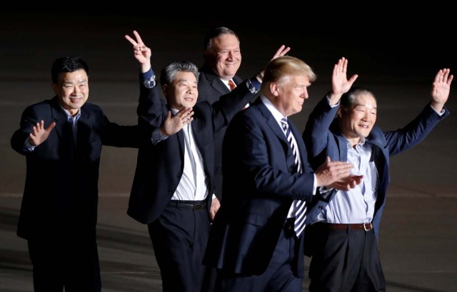 The three Americans formerly held hostage in North Korea gesture next to U.S.President Donald Trump and Secretary of State Mike Pompeo, upon their arrival at Joint Base Andrews, Maryland, U.S., May 10, 2018. REUTERS/Jim Bourg
