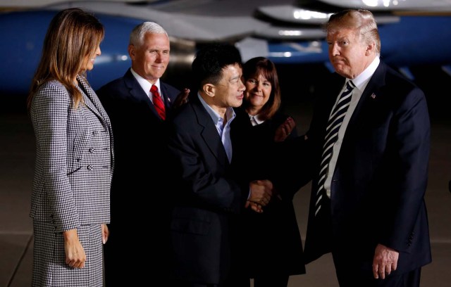 U.S.President Donald Trump shakes hands with one of the three Americans formerly held hostage in North Korea, next to first lady Melania Trump, U.S. Vice President Mike Pence and his wife Karen, upon their arrival at Joint Base Andrews, Maryland, U.S., May 10, 2018. REUTERS/Joshua Roberts