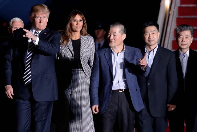 U.S. President Donald Trump and first lady Melania Trump meet the three Americans released from detention in North Korea upon their arrival at Joint Base Andrews, Maryland, U.S. May 10, 2018. REUTERS/Jonathan Ernst